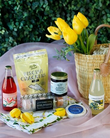 Pretty Little Easter Picnic Basket with Tulips Flower Arrangement