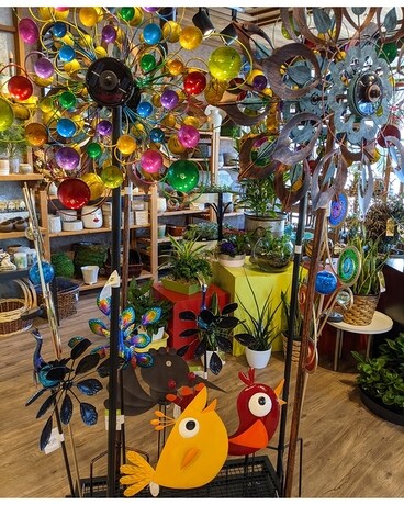 In-store garden décor and wind art Flower Arrangement