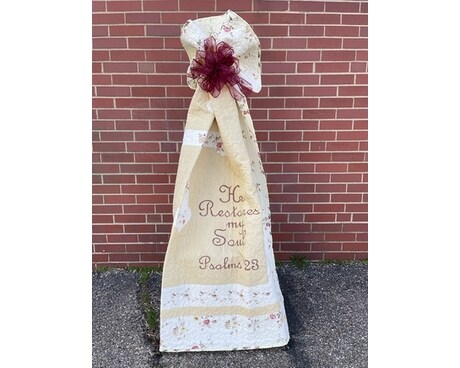 quilt with bow on easel Flower Arrangement