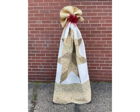 Quilt on Easel with Bow Flower Arrangement