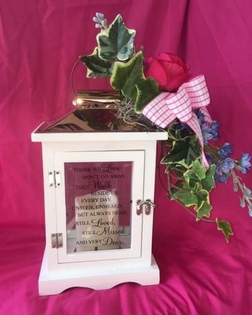 Lantern with Silk Flowers, Ivy and a Bow Flower Arrangement