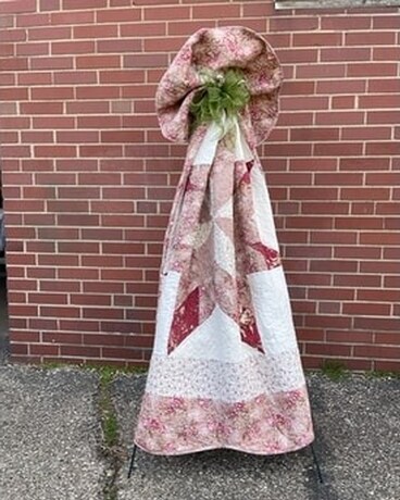 Quilt with Bow on Easel Flower Arrangement